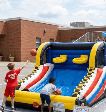 Students competing in inflatable challenge