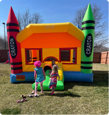 Kids playing on inflatable at local festival